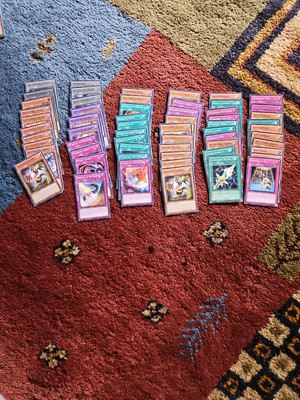 The Yu-Gi-Oh! cards in the image are from the 