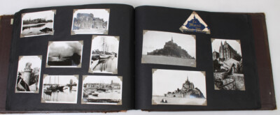 WORLD TRAVELERS PERSONAL PHOTO AND POSTCARD IN LEATHER BOUND ALBUM. -image
