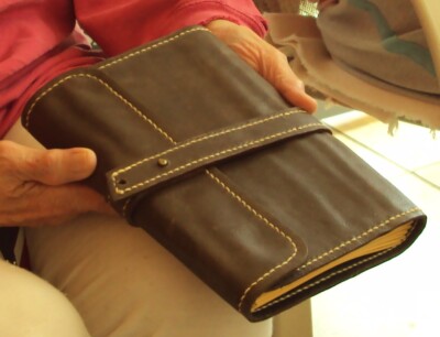 leather journal,brown exterior black interior, saddle stitched,soft gold pages-image