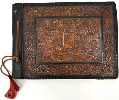 Vintage Leather-Bound Photo Album with Embossed Coat of Arms Design-image